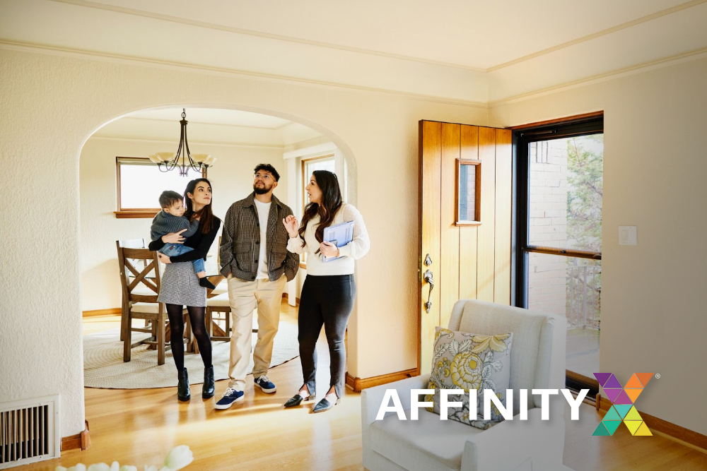 A real estate agent welcoming clients after implementing digital marketing
